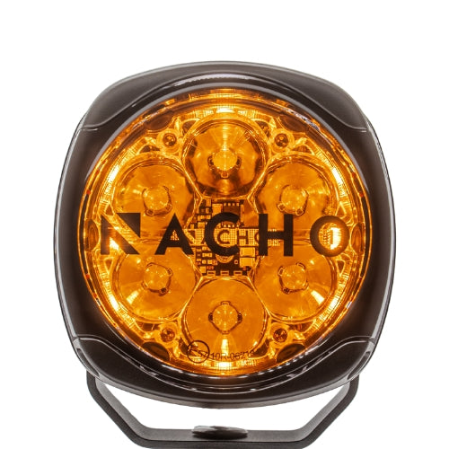 Close up of NACHO Supreme offroad light illuminating a rugged terrain.