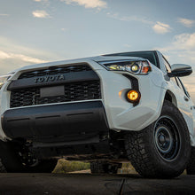 Load image into Gallery viewer, Toyota 4Runner 2023 equipped with the TOYOTA SAE PLUG N PLAY FOG KIT, improving functionality and style.