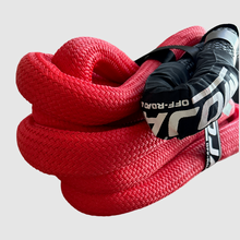 Load image into Gallery viewer, 1 1/2” x 30' Kinetic rope displayed in action during a vehicle recovery, demonstrating its 30% stretch capability.