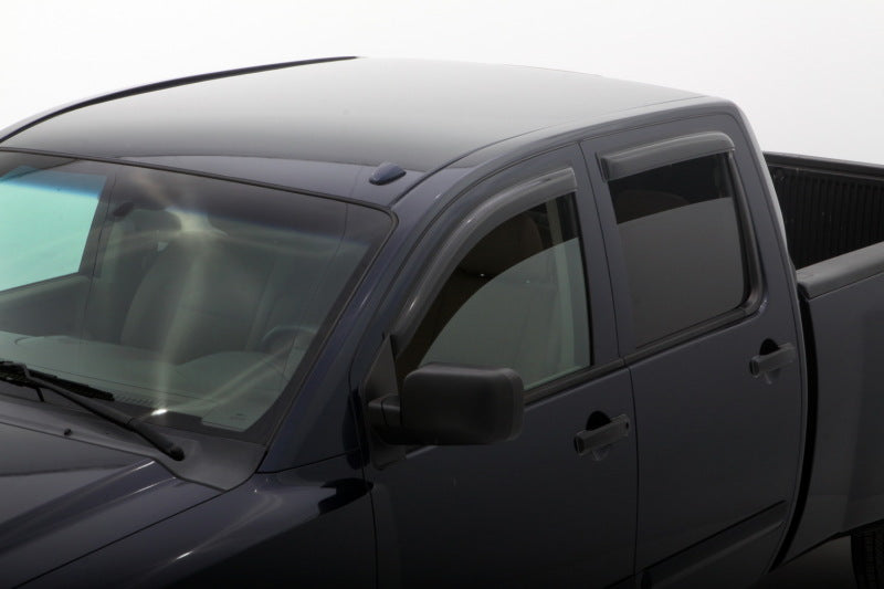 AVS smoke outside-mount window deflectors installed on a 2004-2015 Nissan Titan Crew Cab, 4-piece set