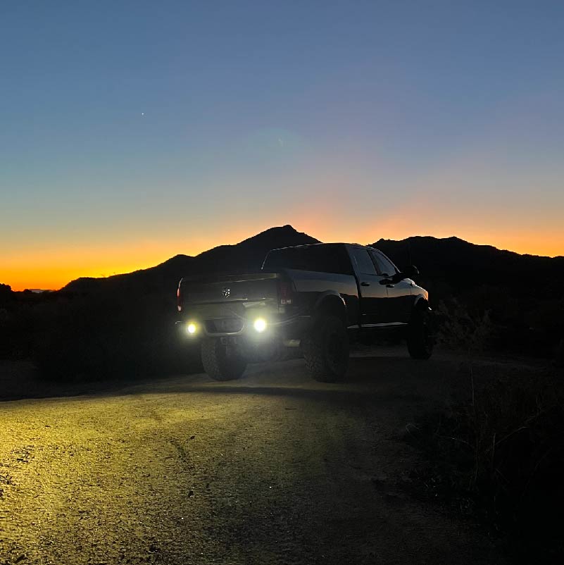 NACHO Quatro Off-Road light placed against an outdoor backdrop.