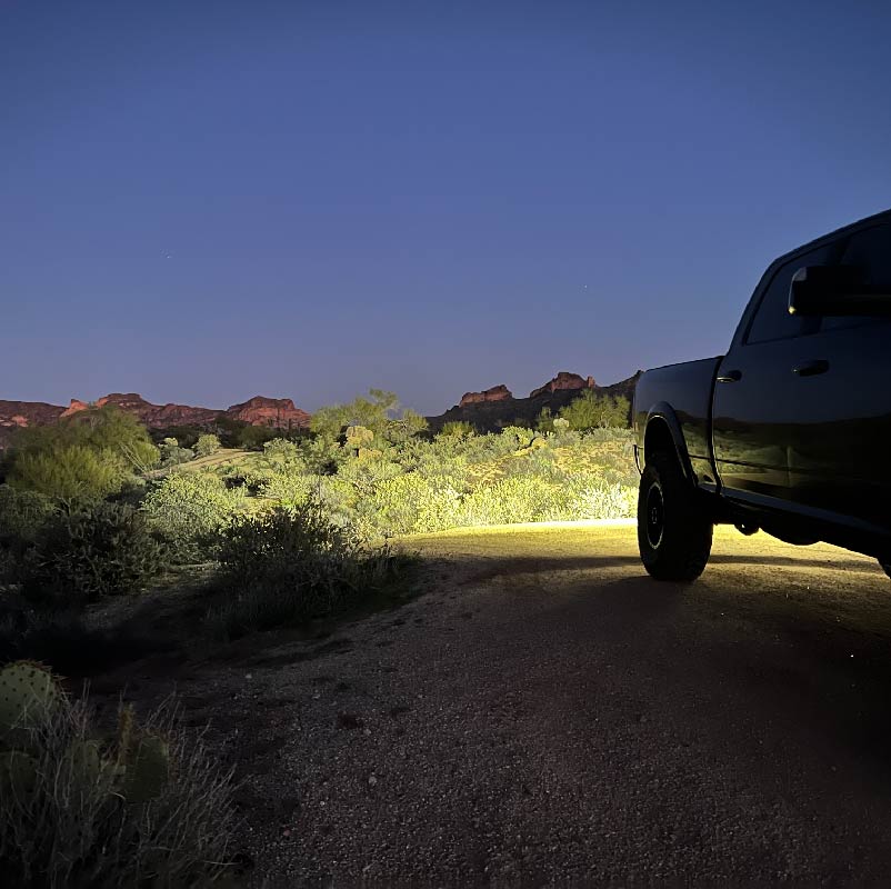 Installation process of NACHO Quatro Off-Road light on a vehicle.