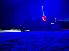 Load image into Gallery viewer, 4FT Ultra Bright LED Whip installed on a truck, elevating nighttime visibility and style.