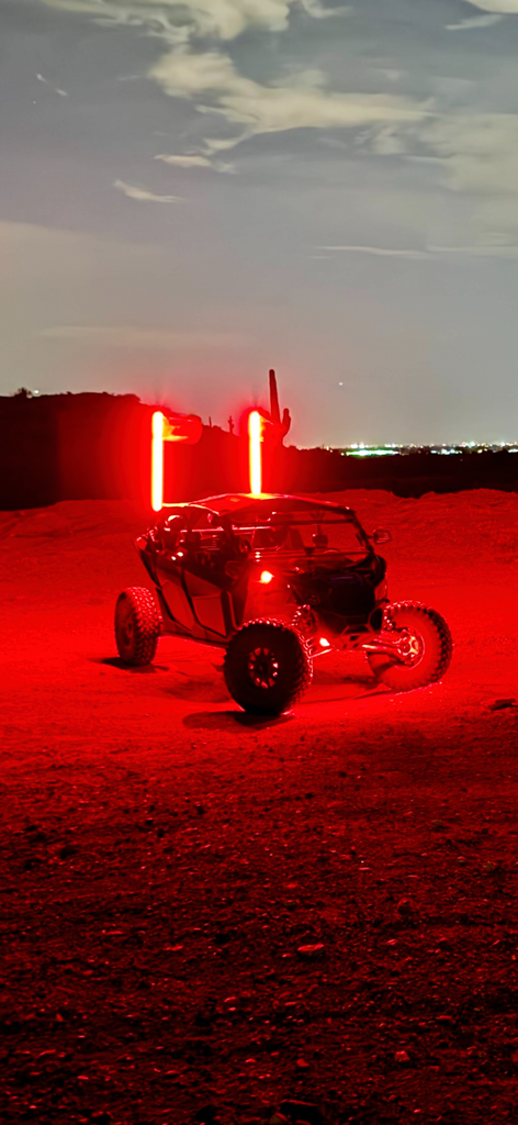 Dynamic view of the 4FT Ultra Bright LED Whip in action at a night off-road event.