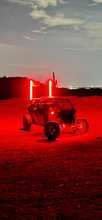 Load image into Gallery viewer, Dynamic view of the 4FT Ultra Bright LED Whip in action at a night off-road event.