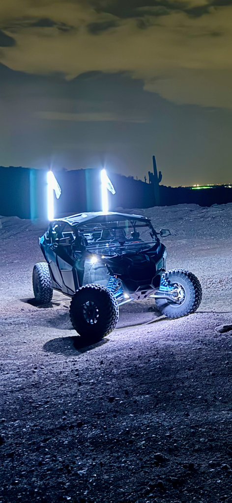 4FT Ultra Bright LED Whip glowing with vibrant colors at night, perfect for off-road adventures.