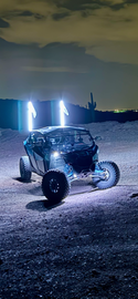 4FT Ultra Bright LED Whip glowing with vibrant colors at night, perfect for off-road adventures.