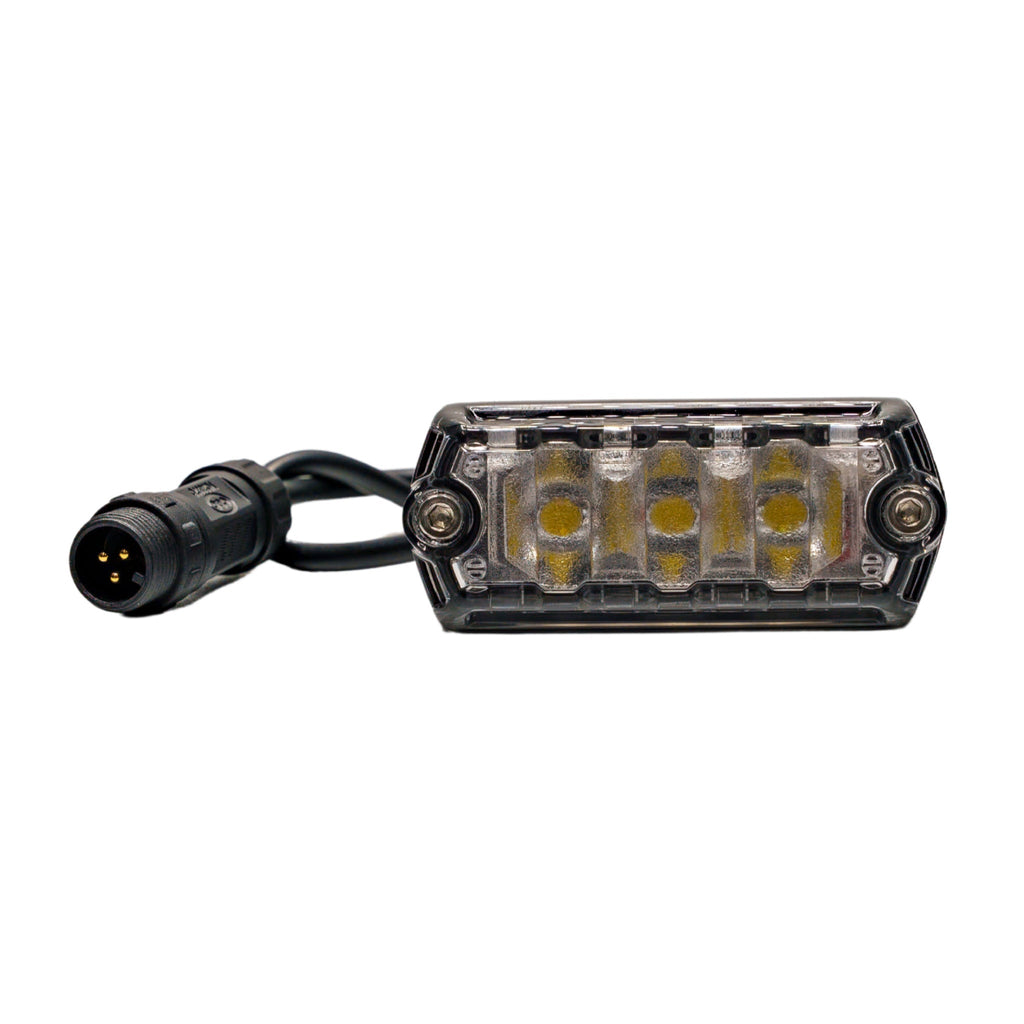NACHO NANO 2100 Lumen LED Light illuminating a workspace with bright white light.