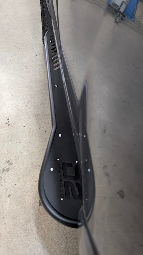 D2 Off-Road 2010-2024 Toyota 4Runner Rock Sliders - Heavy-Duty Bolt-On installed on a 4Runner in a rugged outdoor setting.