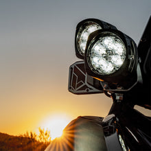 Load image into Gallery viewer, Outdoor enthusiasts using NACHO Quatro Off-Road light for night adventures.