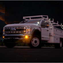 Load image into Gallery viewer, NACHO Quatro SAE fog light with amber lens, capturing the essence of rugged terrain use.