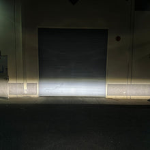 Load image into Gallery viewer, Close-up of the TRL feature on the Quatro SAE fog lights in the Gen 6 Bronco Plug N Play Fog Kit.