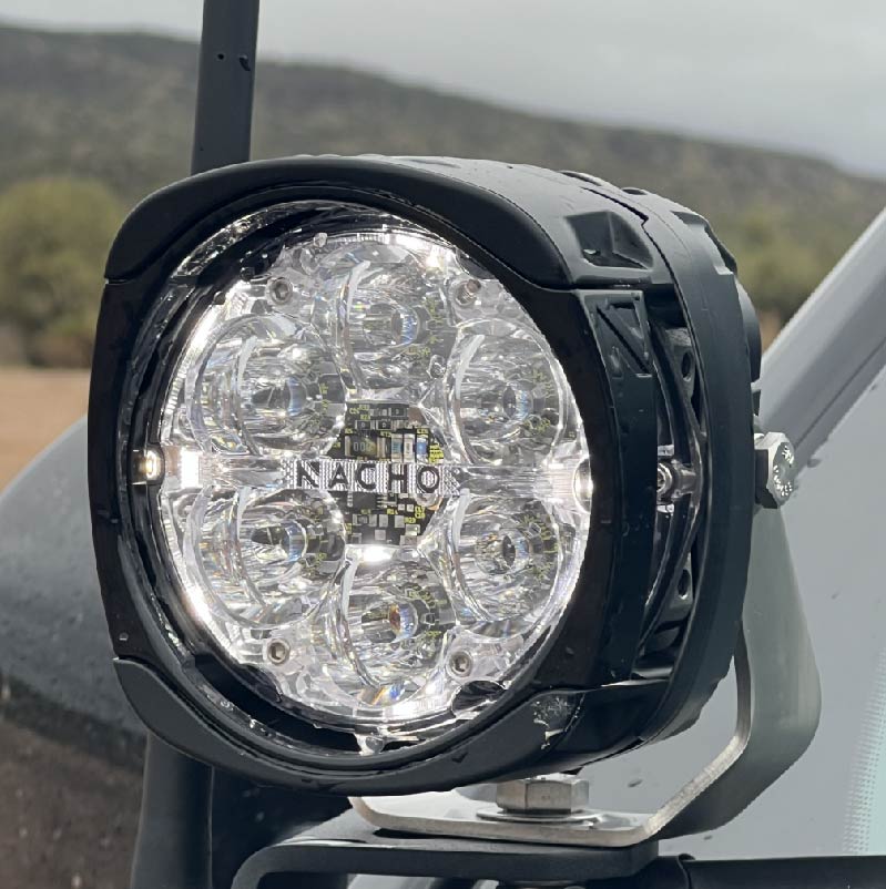 Display setup of NACHO Quatro Off-Road lights at an outdoor event.