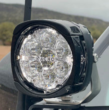 Load image into Gallery viewer, Display setup of NACHO Quatro Off-Road lights at an outdoor event.