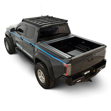 Load image into Gallery viewer, Westin 24-26 Toyota Tacoma 5ft Bed Manual Retractable Tonneau Cover - Black
