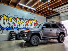 Load image into Gallery viewer, Installation of Bilstein 0-2.5" Lift Kit in a 2010–2024 Toyota 4Runner, highlighting the bolt-on design for easy setup without cutting or welding.