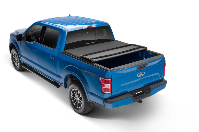 Lund 04-15 Nissan Titan (6.5ft. Bed w/o Utility TRack) Genesis Elite Tri-Fold Tonneau Cover - Black