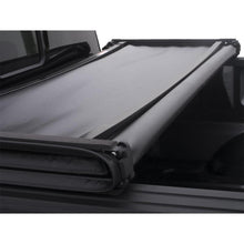 Load image into Gallery viewer, Lund 04-17 Nissan Titan (5.5ft. Bed w/Titan Box) Genesis Tri-Fold Tonneau Cover - Black
