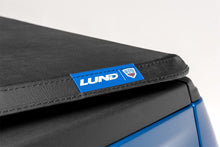Load image into Gallery viewer, Lund 04-17 Nissan Titan (5.5ft. Bed w/Titan Box) Genesis Tri-Fold Tonneau Cover - Black