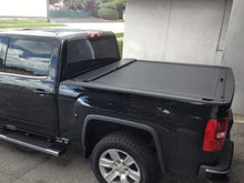 Load image into Gallery viewer, Roll-N-Lock 15-18 Chevy Silverado/Sierra 2500/3500 SB 77-3/8in M-Series Retractable Tonneau Cover